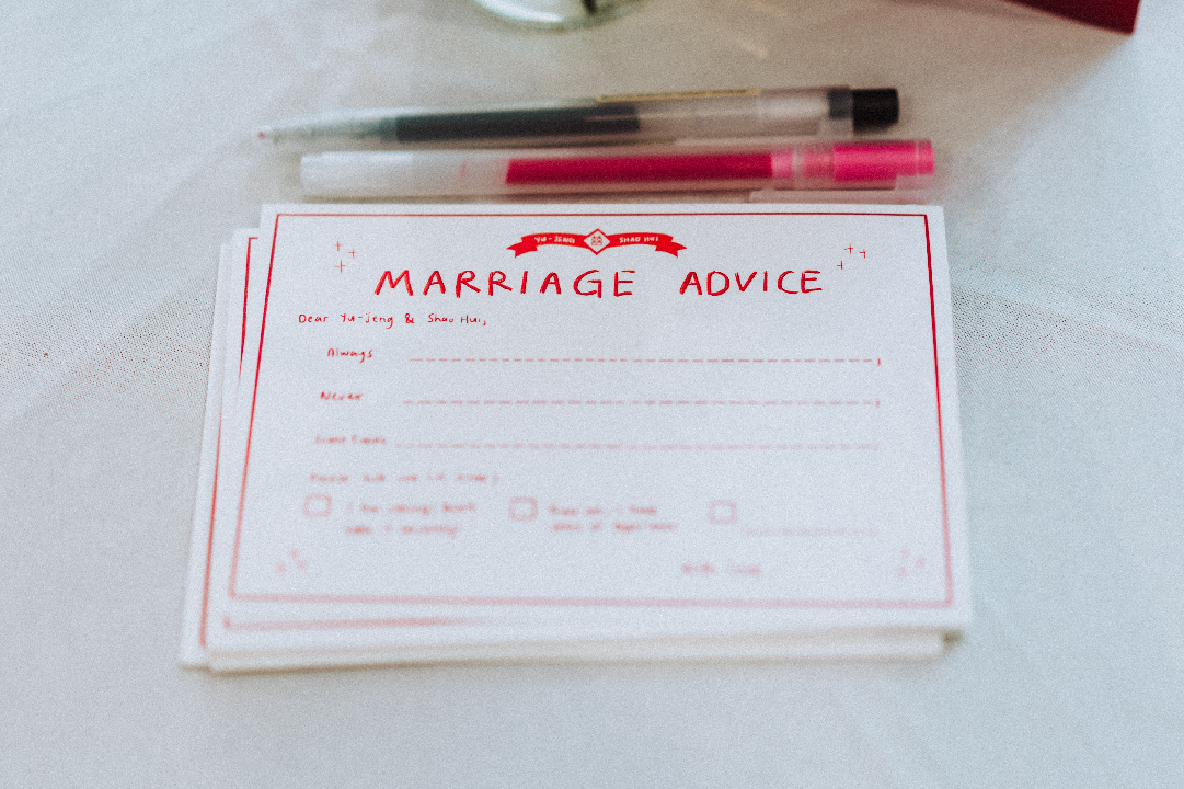 A printed marriage advice card on the table